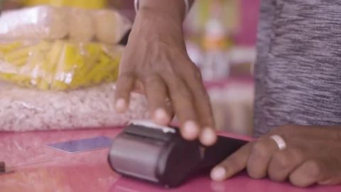 Buyer is making money using mobile by taping on machine Stock Footage 167080473