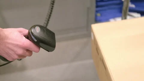 Buyer reads barcode Data Matrix using digital scanner from packages goods f.. Vidéo 245816074