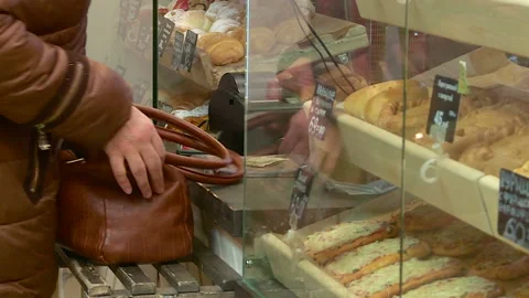 The buyer receives bread in the store Stock Footage 103447365
