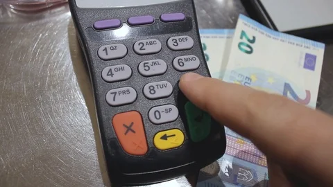 The buyer in the store dials a PIN code on the terminal. Stock Footage 127394987