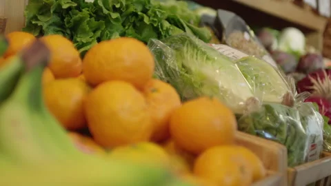 A buyer takes cabbage from a shell with vegetables and fruits Stock Footage 265084778