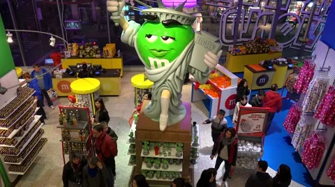 Buyers inside of the M&amp;M's World store  in Times Square, NYC, USA. Stock Footage 49873344