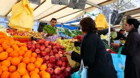 Buying lettuce and fruit Stock Footage 10876445
