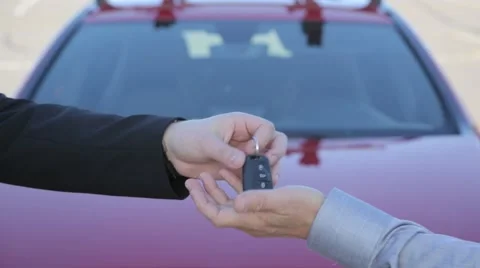 Buying A New Car From A Used Car Salesman Handing Keys To Buyer Stock Footage