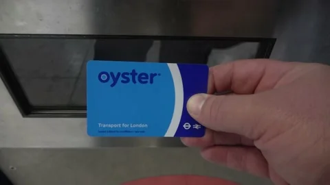Buying An Oyster card At A Ticket Machine in the London Tube Stock Footage 154148412