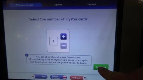 Buying An Oyster card At A Ticket Machine in the London Tube Stock Footage 154148551