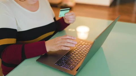 Buying products online while sitting at a desk in a cozy room Stock Footage 304822524