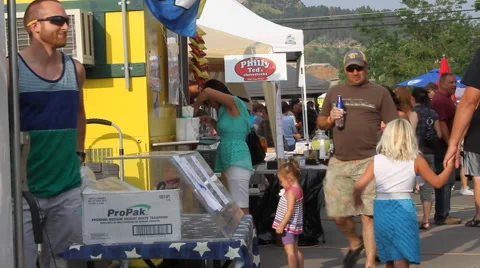 Buying refreshments at a street fair Stock-Footage 40313529