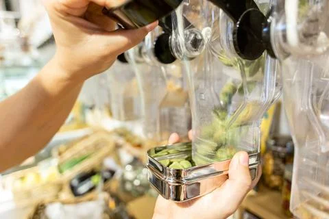 Buying snacks in bulk at Zero Waste Shop Stock Photos