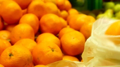 Buys fruit in the store. Close up. Shopping in Grocery Store. Stock Footage 112665659