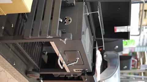 Buys a grill in a store vertical video Stock Footage 260854206