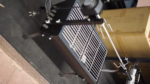 Buys small grills in a store vertical video Stock Footage 260019013