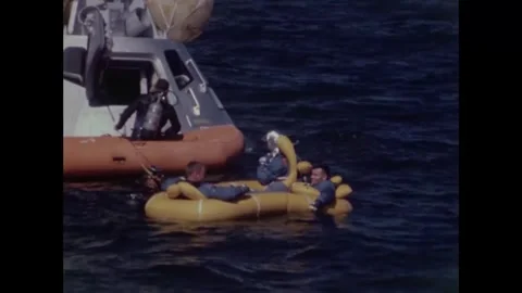 Buzz Aldrin, Neil Armstrong, Fred Haise in life-raft for water egress training Stock Footage 271517792