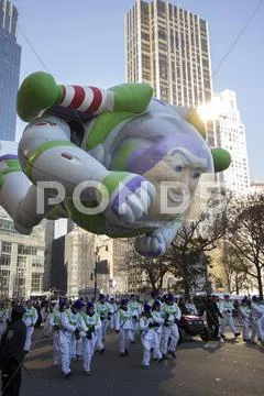 Buzz lightyear balloon flying through city in 2013 Macy's Parade Stock Photos