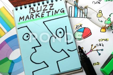 Buzz marketing written on a blue paper. Stock Photos