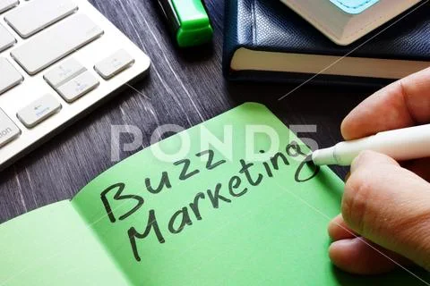 Buzz marketing written by marketologist in the note. Stock Photos