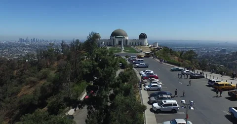 Buzz over Griffith Observatory to downtown LA Stock-Footage 60634627