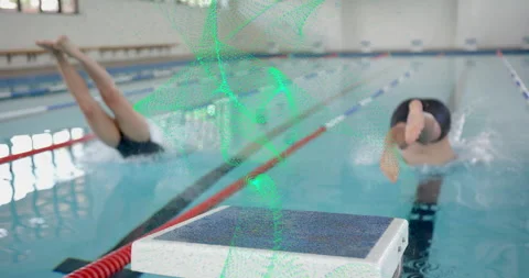 On buzzer sound two swimmers pushing off starting block and generating splashes Stock Footage 314996716