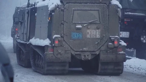 BVS 10 Viking vehicles head out in the woods in the snow Video stock 114018674