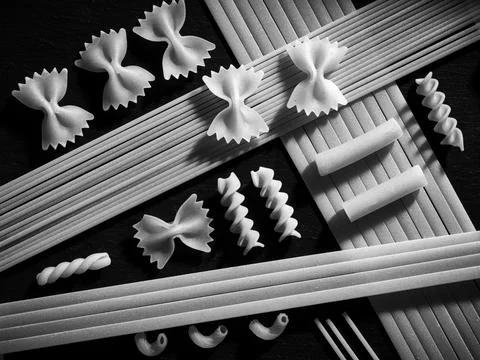 B&amp;W flatlay of various dried pasta. Stock Photos