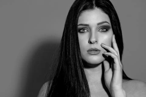 BW portrait of a alluring model with long hair posing at studio Stock Photos