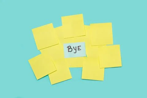 Bye single word handwritten on a light blue sticky paper Foto stock