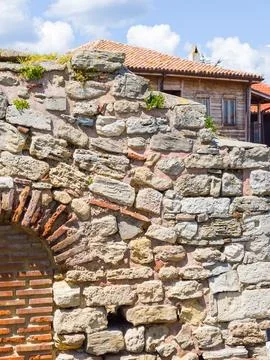 ​Byzantine style brickwork and rough stone wall Stock Photos