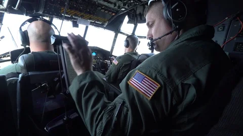C-130 Hercules navigator operating flight chart computer Stock Footage 113610458