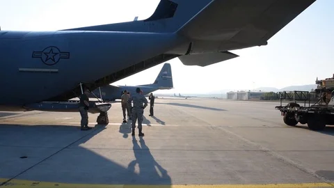 C-130 J loadmaster from Dyess AFB preparing to load a Humvee - 2015 Stock Footage 107537978