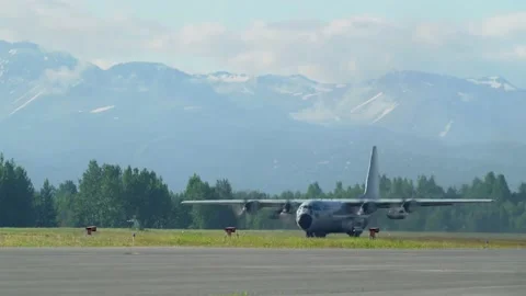 C-130 Takeoff with Mountains distant Stock Footage 131888125