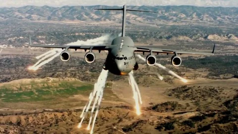 C-17 Globemaster III deploys Countermeasure flares Stock Footage 75038095