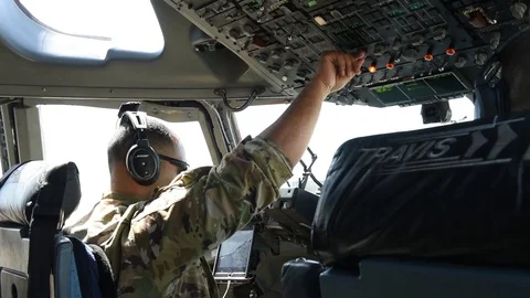 C-17 Globemaster pilot adjusting flight panel controls Stock Footage 109160306