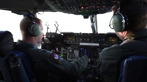 C-17 Globemaster pilots adjust cockpit controls Video stock 97444794
