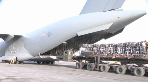 C-17A Globemaster III crew members  load pallets at Kandahar Airfield Stock Footage 33082501