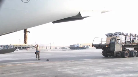 C-17A Globemaster III crew members  load pallets at Kandahar Airfield Stock Footage 33082522