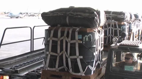 C-17A Globemaster III crew members  load pallets at Kandahar Airfield Stock Footage 33082907