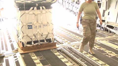 C-17A Globemaster III crew members  load pallets at Kandahar Airfield Stock Footage 33083555