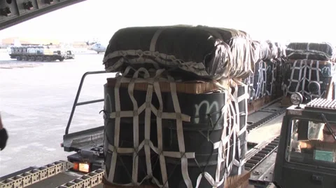 C-17A Globemaster III crew members  load pallets at Kandahar Airfield Stock Footage 33084008