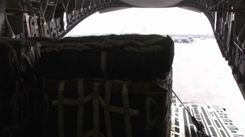 C-17A Globemaster III crew members  load pallets at Kandahar Airfield Stock Footage 33084732