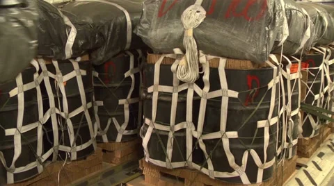 C-17A Globemaster III crew members  load pallets at Kandahar Airfield Stock Footage 33084946