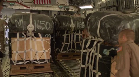 C-17A Globemaster III crew members  load pallets at Kandahar Airfield Stock Footage 33085592