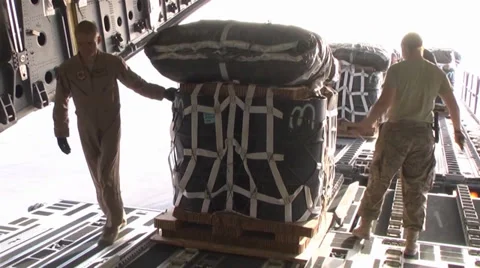 C-17A Globemaster III crew members  load pallets at Kandahar Airfield Stock Footage 33086872