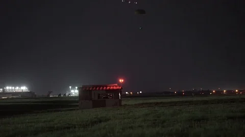 C-5M Super Galaxy drops two parachute packages Stock Footage 113343662