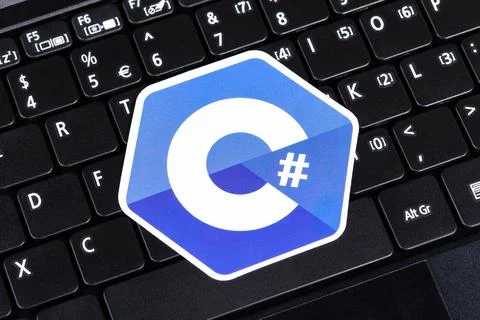 C#, C sharp programming language symbol, logo sticker on a laptop keyboard Stock Photos