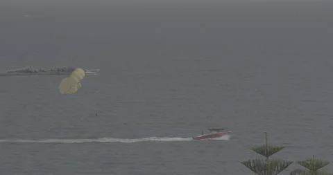 C-LOG Parachuting In Turkey. Yellow Parasail Wing Pulled By Red Boat. Sea Summer Stockbeeldmateriaal 256606322