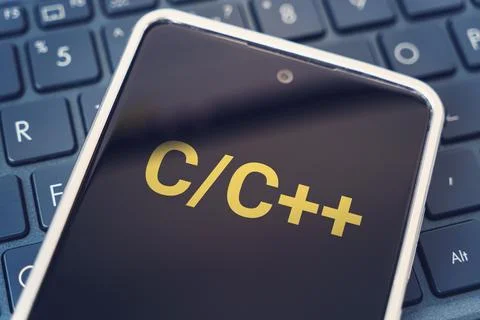C Programming language for mobile development, concept. Smartphone on the l.. Stock Photos