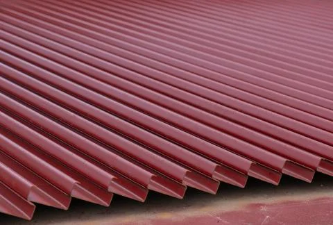 C shape painted rust-proof, brown on steel stack dry outdoor. Stock Photos