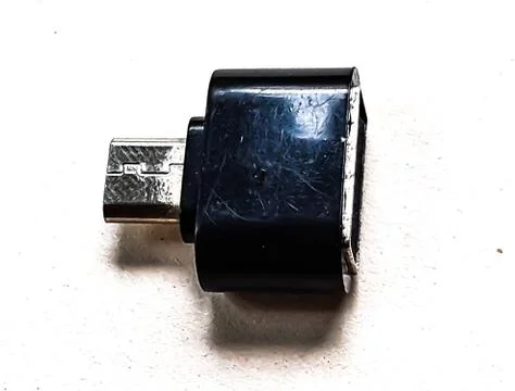 A C type O T G connector in black color and white background. Stock Photos