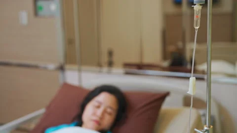 C0024 Saline solution with syring line on patient hand Stock Footage 203901659