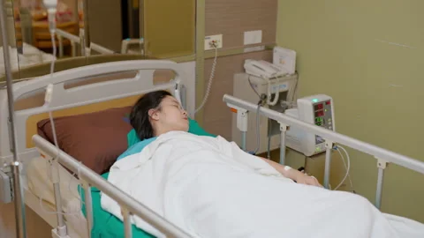 C0033 Patient laying down on bed after surgery Stock Footage 205213711